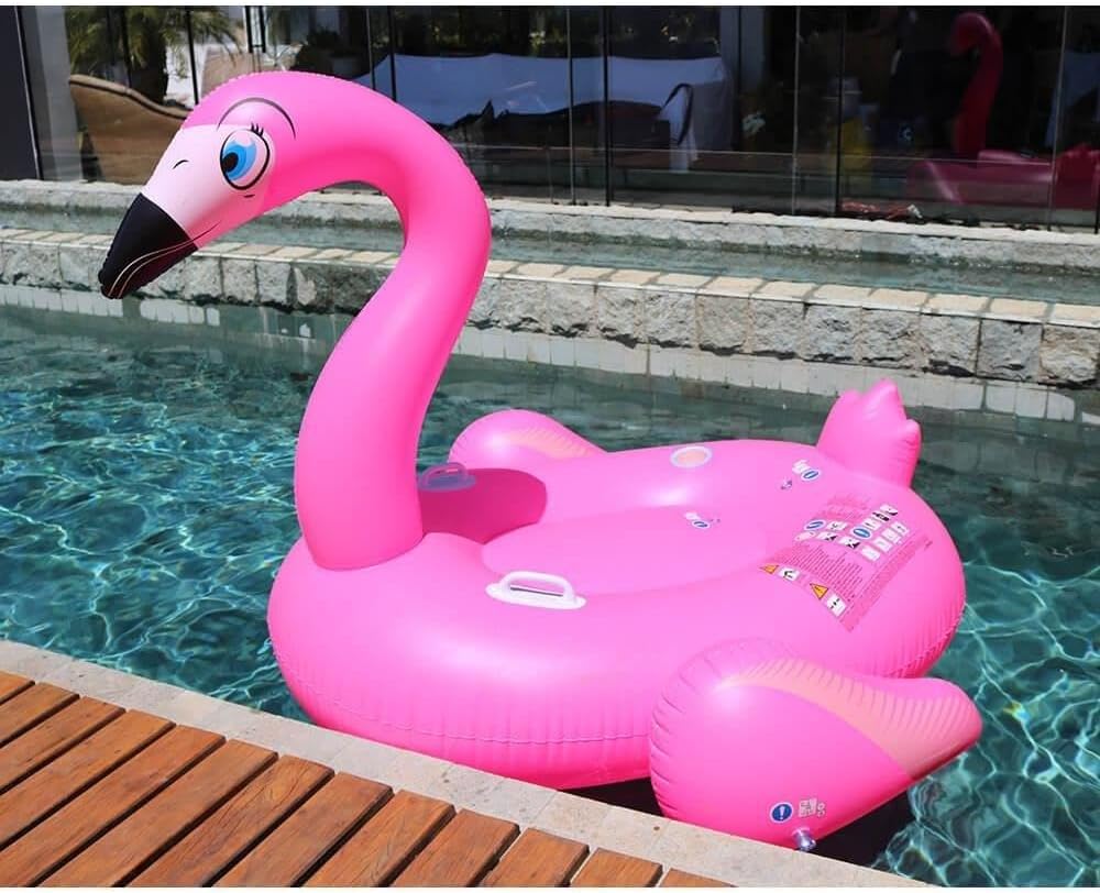 Pink inflatable flamingo pool float in a swimming pool.