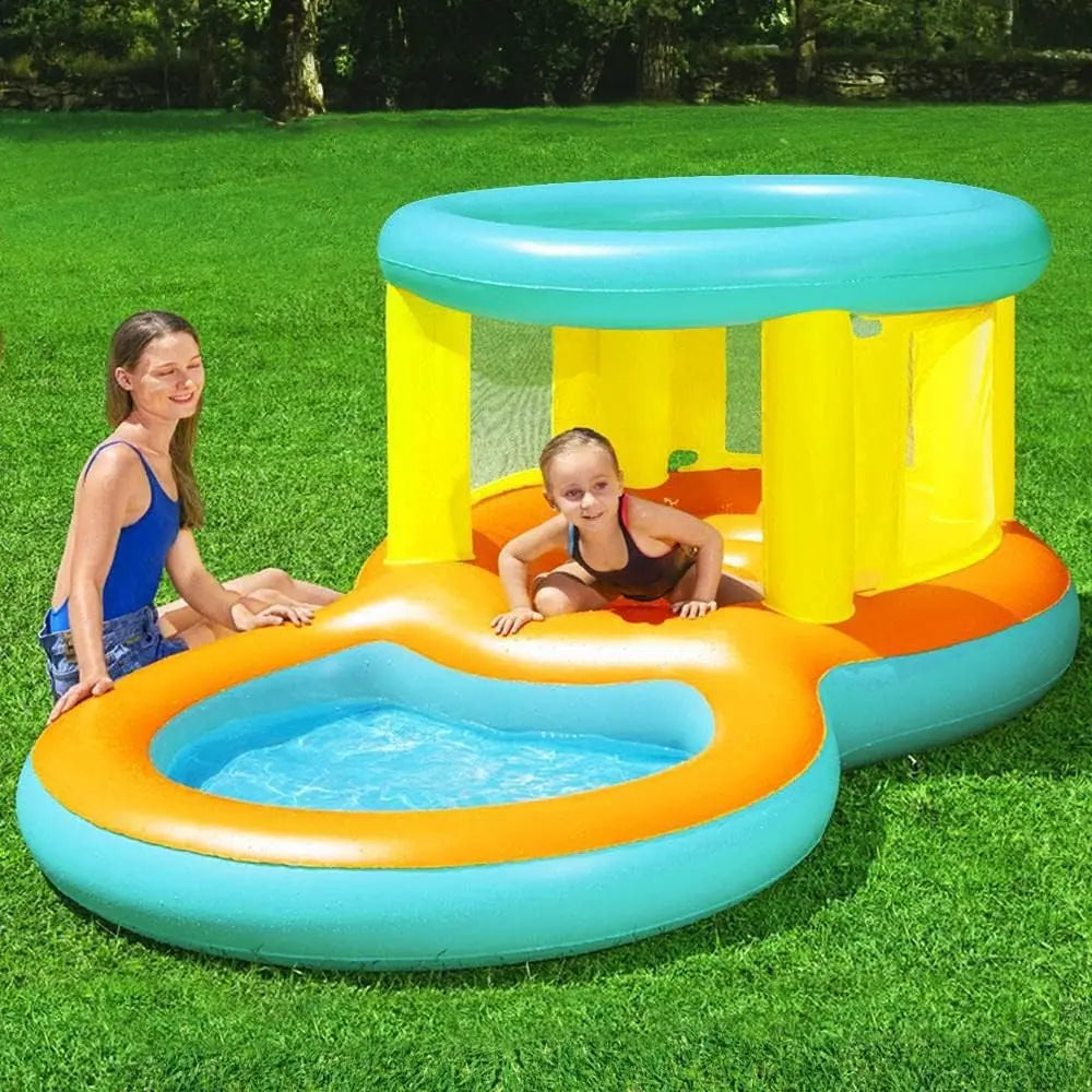 Inflatable play center with pool on grass, children playing