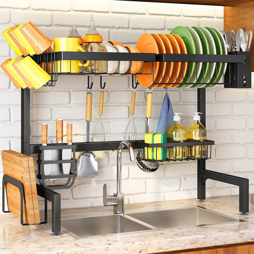 Kitchen dish rack with cutlery and plates above a sink