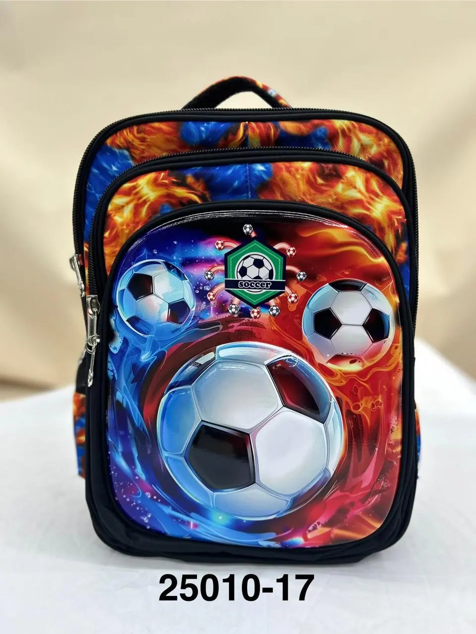 Backpack with soccer ball design and flames on a beige background