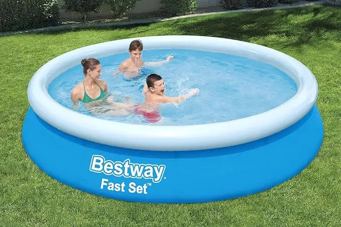 Inflatable pool with 'Bestway' branding, people playing in it on grass.