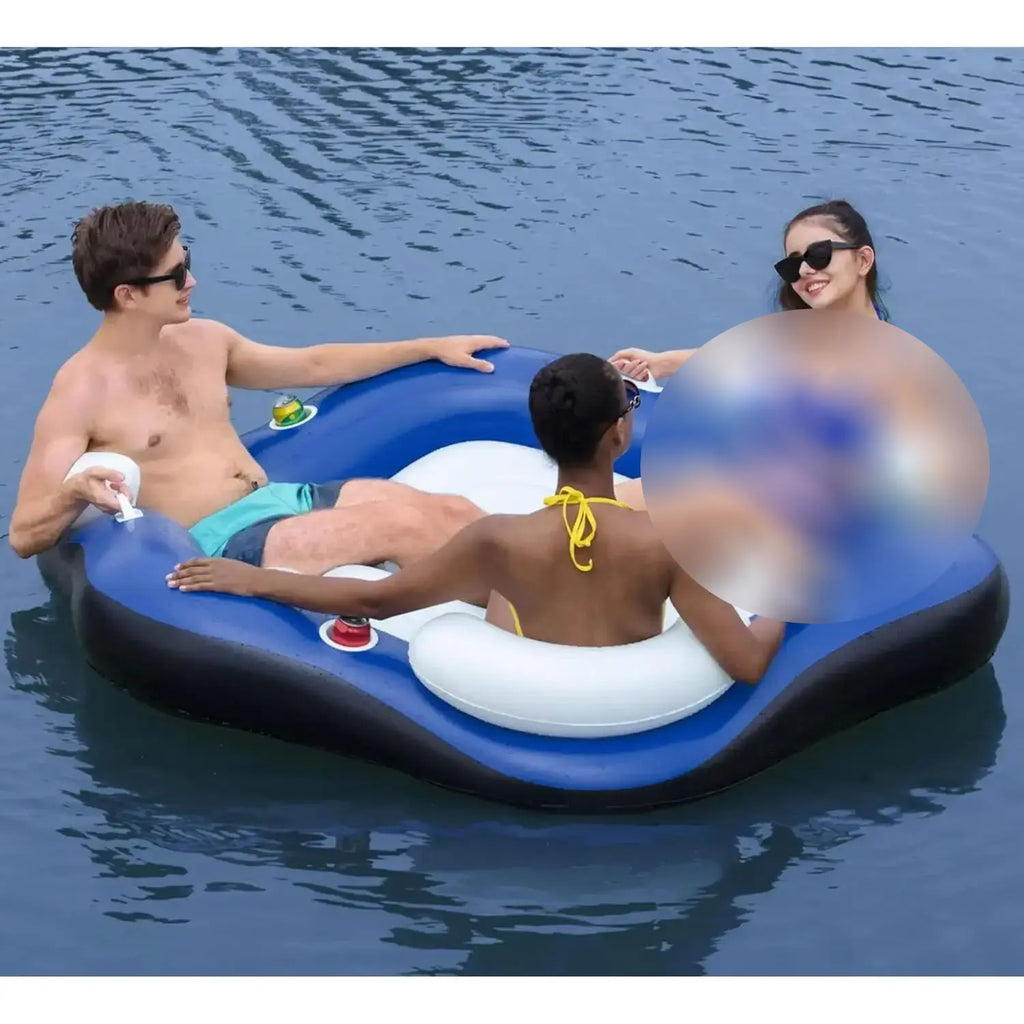 Three people on a blue inflatable raft in the water
